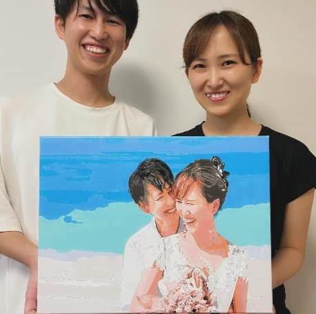 海辺のウェディング作品を持つA様ご夫妻