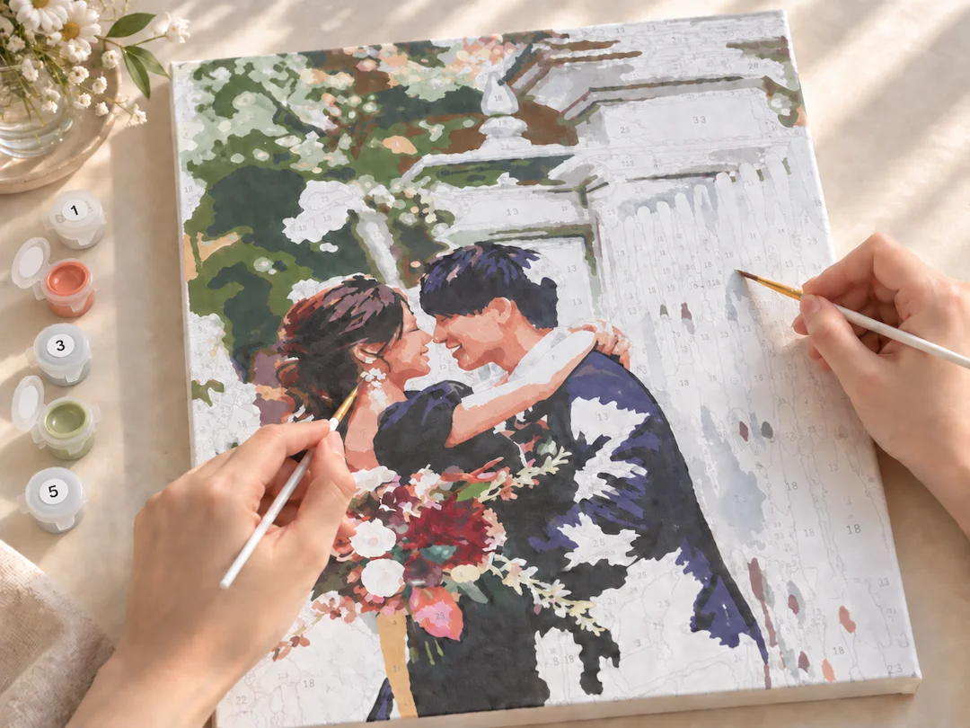 結婚写真の番号付きキャンバスを、ふたりで筆を使って塗る制作イメージ